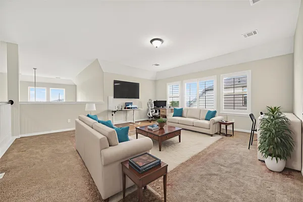 a spacious bathroom with a tub sink shower and mirror