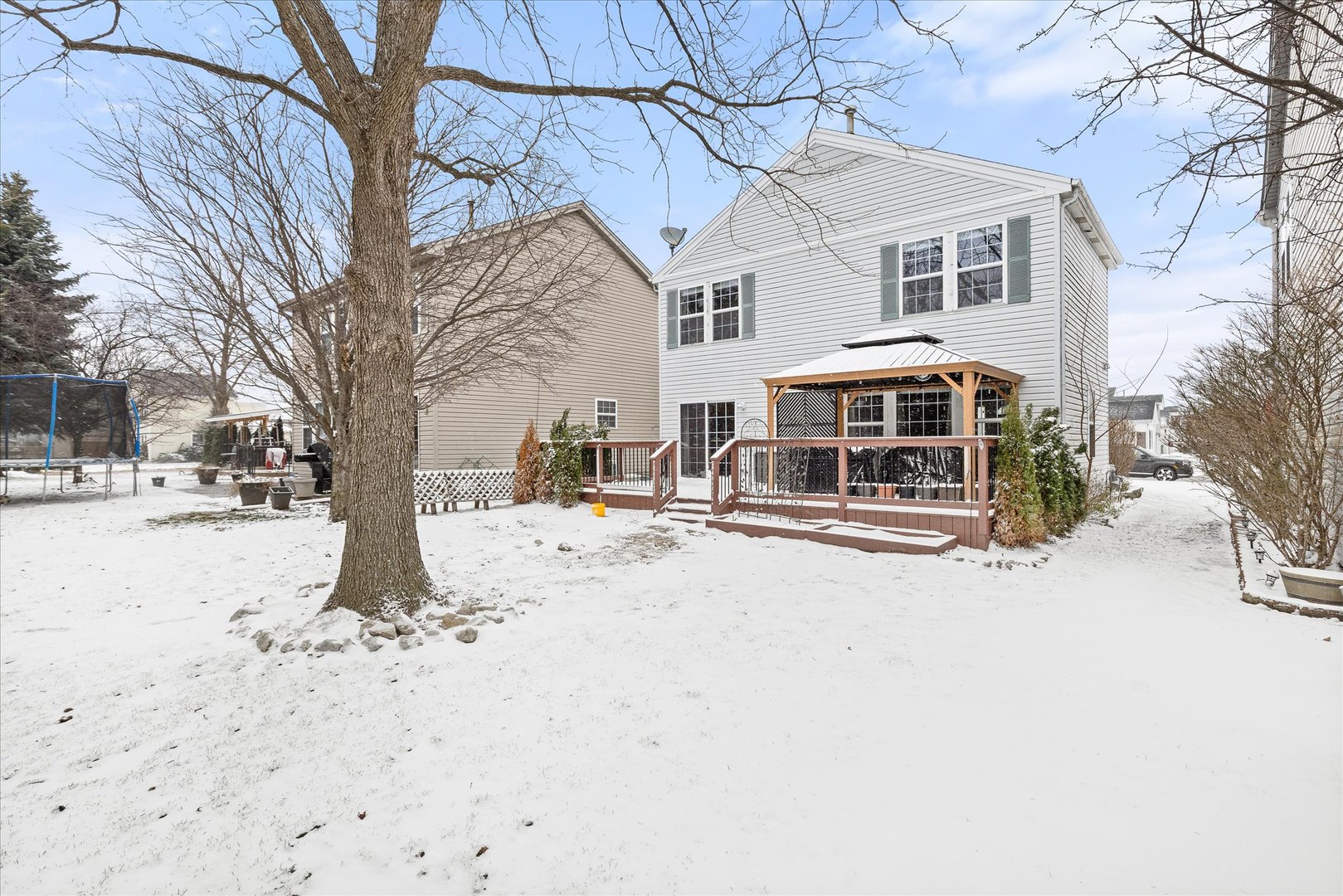 16830 South Parker Ridge Drive Lockport, IL 60441 - Photo 26 of 35 a view of a white house with a snow on the road
