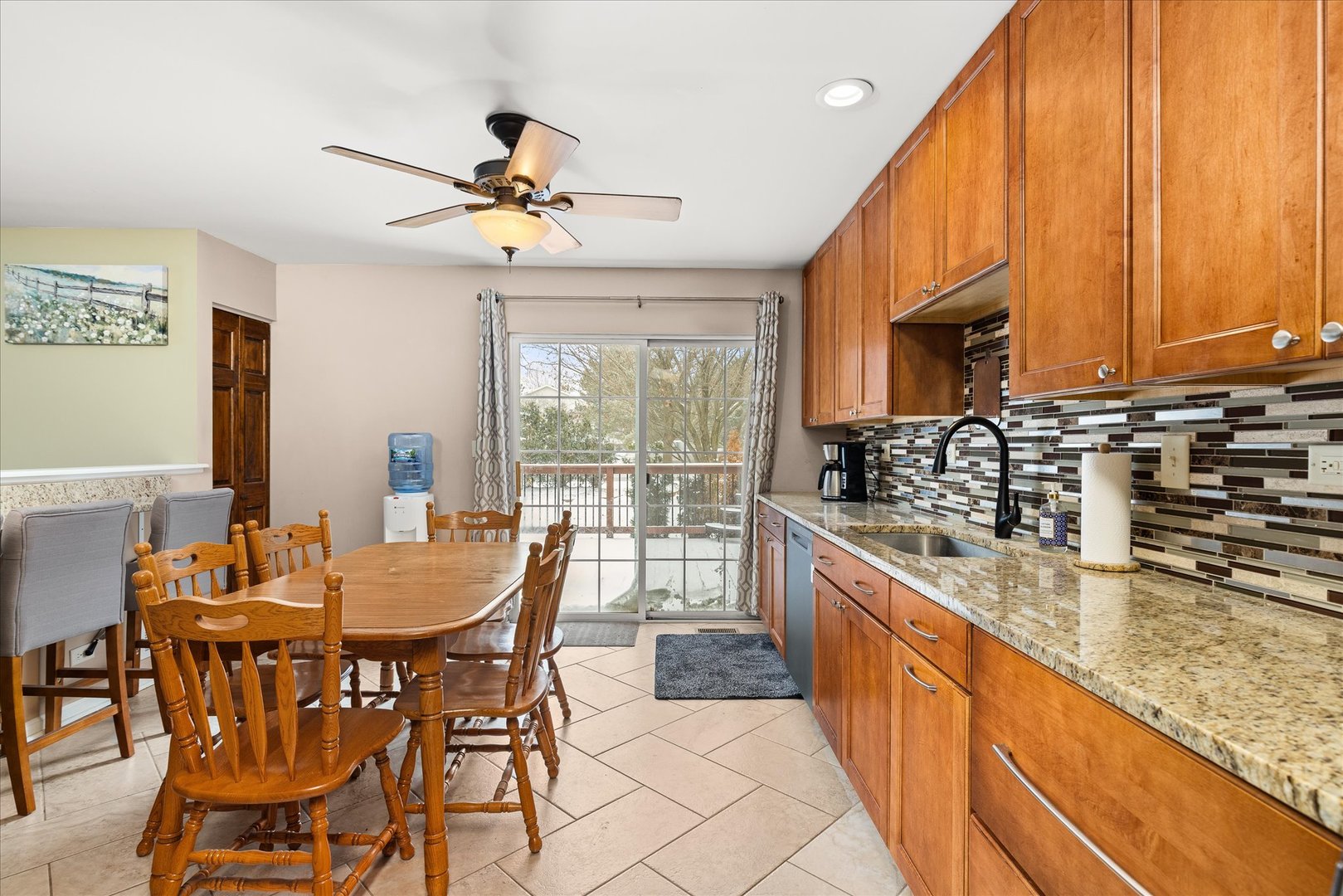 16830 South Parker Ridge Drive Lockport, IL 60441 - Photo 10 of 35 a dining room with stainless steel appliances granite countertop a kitchen island furniture a large window and a sink