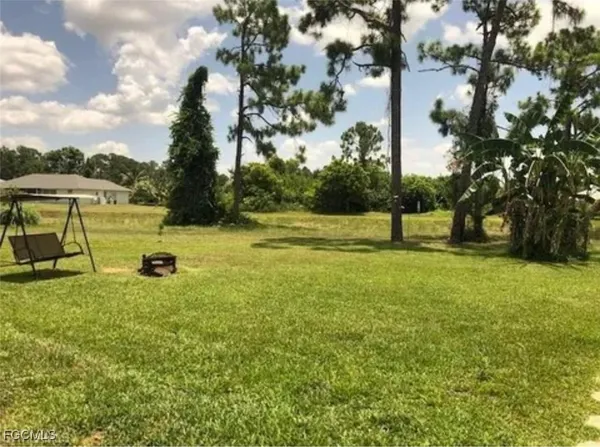 a view of a park with swings