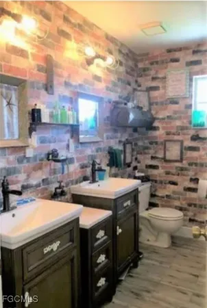a utility room with lots of appliances and cabinets