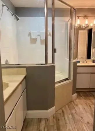 a view of a bathroom with a sink and a mirror
