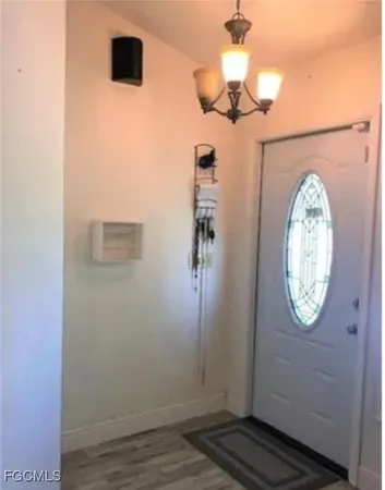 a view of entryway with wooden floor