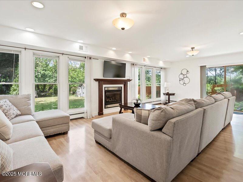 552 Prospect Avenue Spring Lake Heights, NJ 07762 - Photo 11 of 25 a living room with furniture and a fireplace