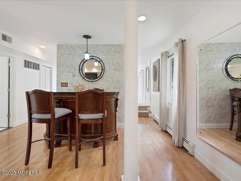 552 Prospect Avenue Spring Lake Heights, NJ 07762 - Photo 13 of 25 a view of a dining room with furniture and wooden floor