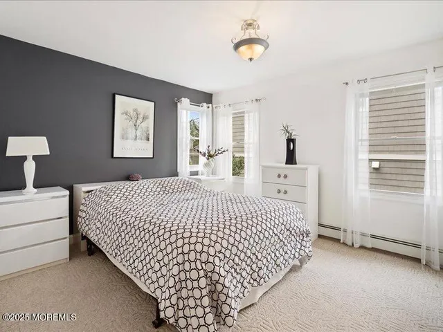 a bedroom with bed and window