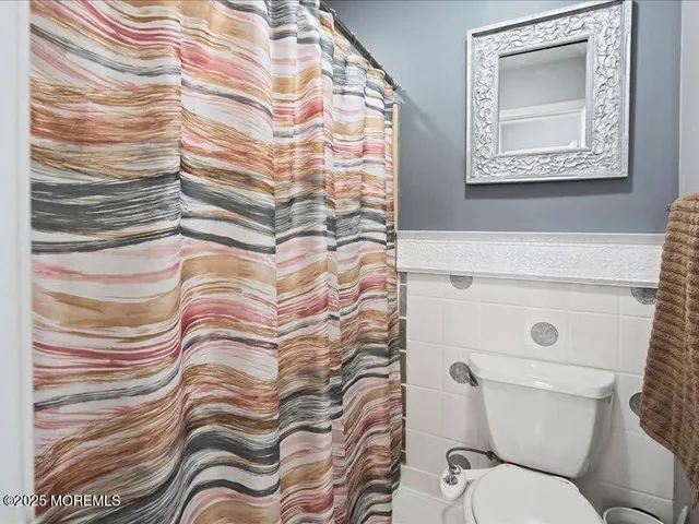 a bathroom with a toilet and a sink