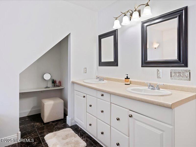 552 Prospect Avenue Spring Lake Heights, NJ 07762 - Photo 19 of 25 a bathroom with a toilet sink and mirror