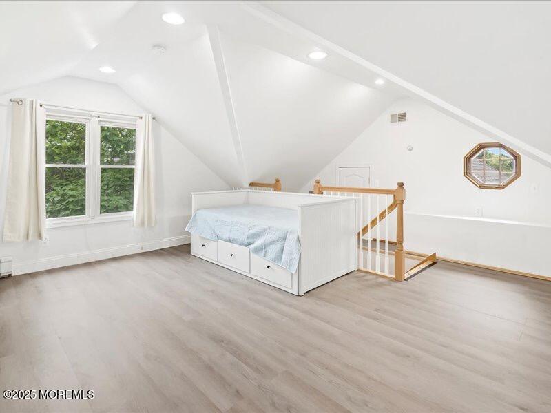 552 Prospect Avenue Spring Lake Heights, NJ 07762 - Photo 22 of 25 a spacious bedroom with a bed and a window