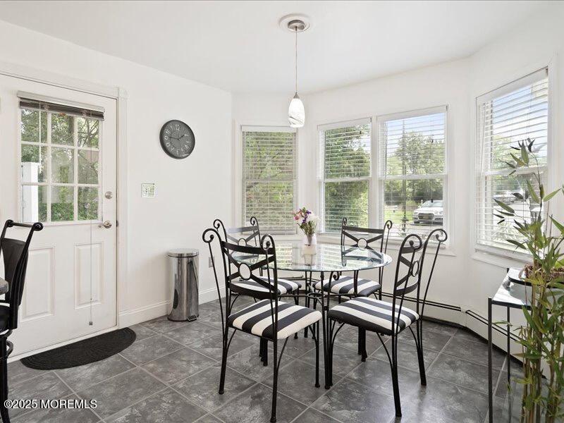 552 Prospect Avenue Spring Lake Heights, NJ 07762 - Photo 9 of 25 a view of a dining room with furniture window and outside view