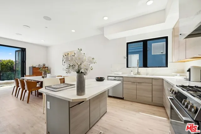 a kitchen with a table and chairs in it