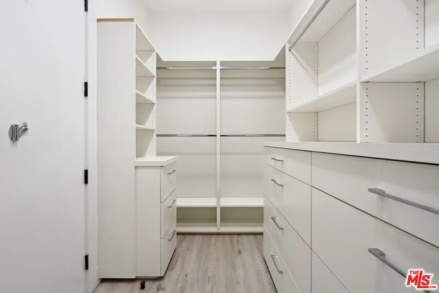 a view of closet area with empty racks