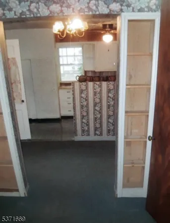 a view of a livingroom with furniture and staircase