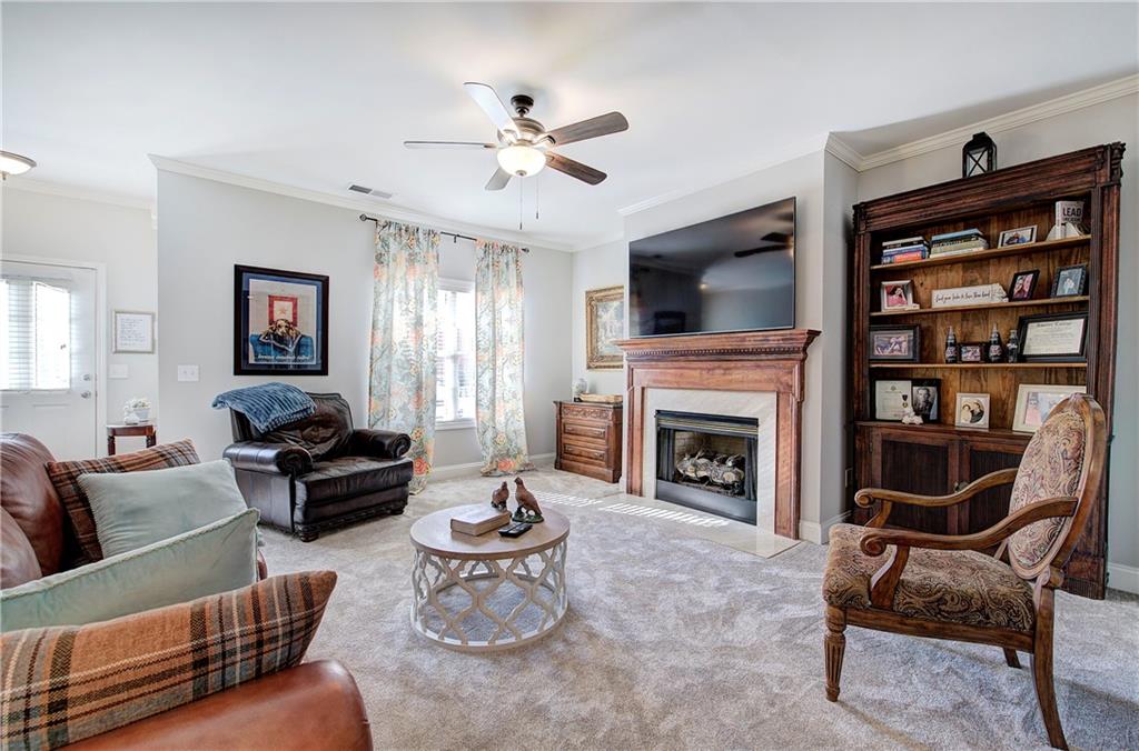618 Manor Way Cartersville, GA 30120 - Photo 8 of 35 a living room with furniture fireplace and flat screen tv