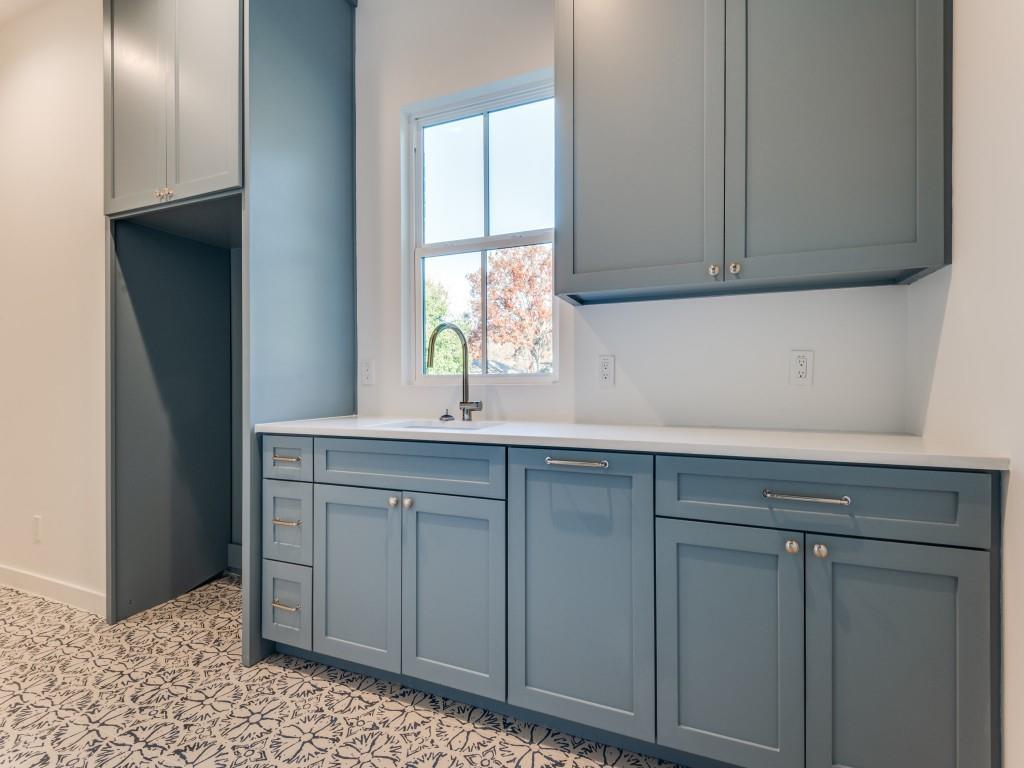 3838 Princess Lane Dallas, TX 75229 - Photo 14 of 26 a kitchen with white cabinets a sink and dishwasher
