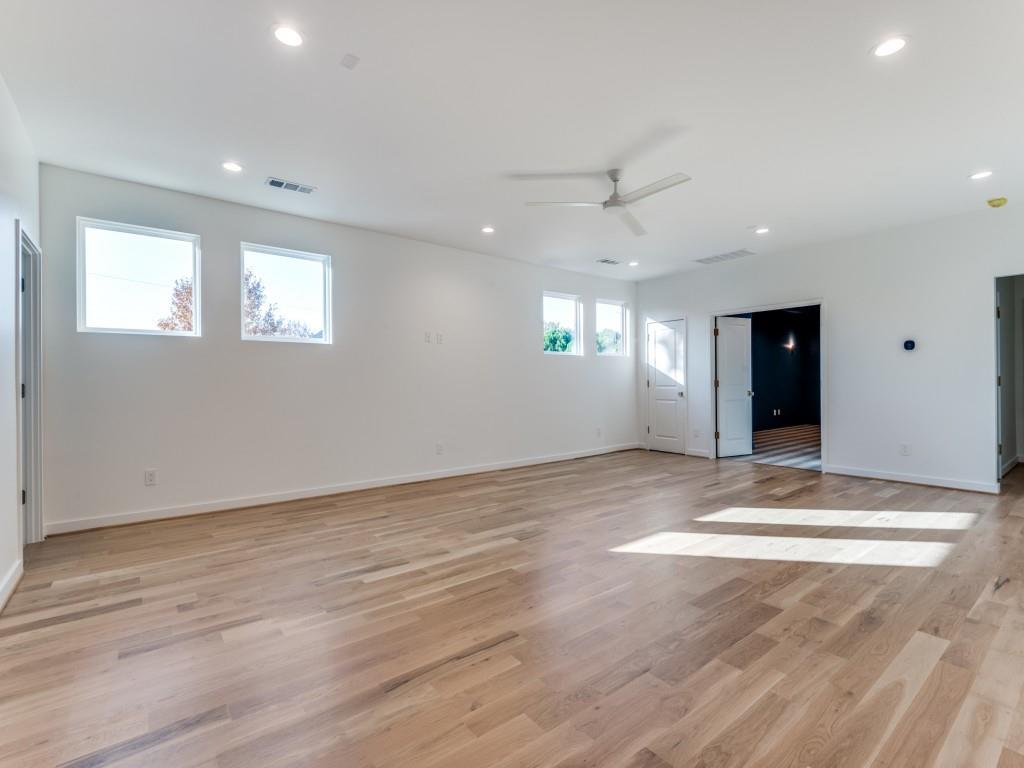 3838 Princess Lane Dallas, TX 75229 - Photo 17 of 26 a view of an empty room with wooden floor and windows