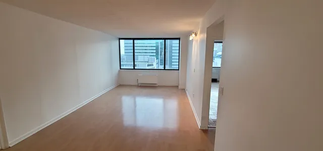 a view of a window in an empty room