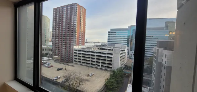 a view of a city with tall buildings