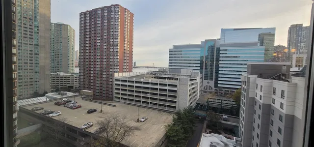 a kitchen with a refrigerator sink and cabinets