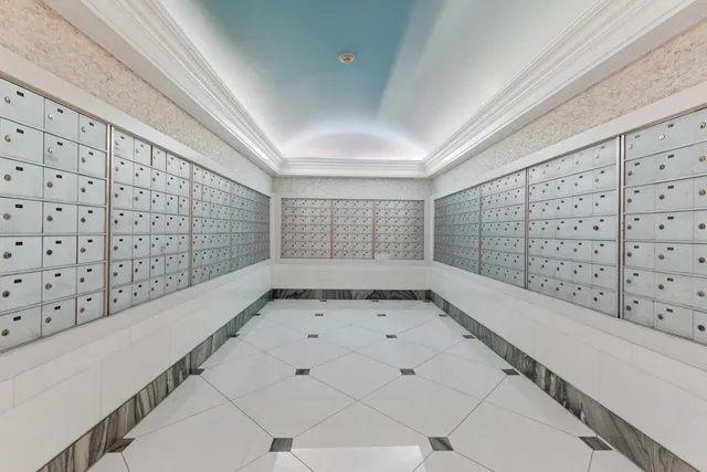 a room with pool table and windows