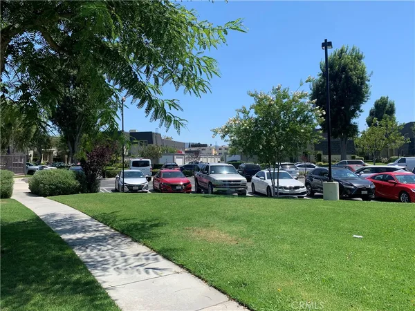 a view of a car park in front of house