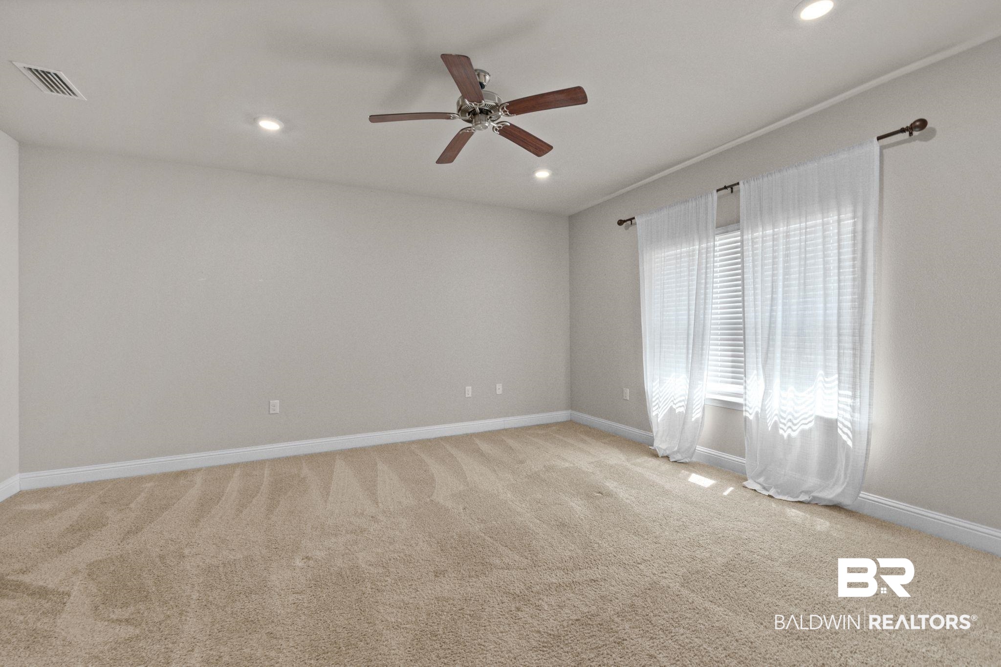 24769 Slater Mill Road Daphne, AL 36526 - Photo 19 of 38 Unfurnished room featuring ceiling fan and light colored carpet