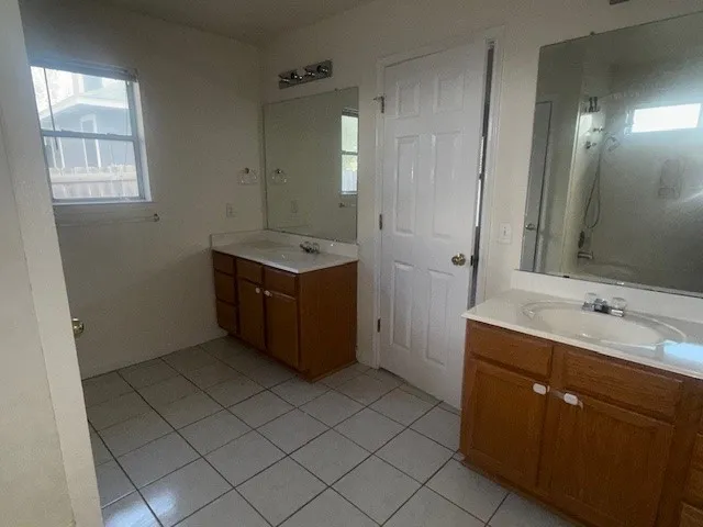 a room with a sink and a mirror