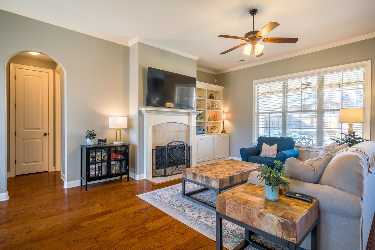 254 Estanaula Road Collierville, TN 38017 - Photo 5 of 25 a living room with furniture fireplace and a flat screen tv