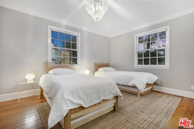 a bedroom with bed and window