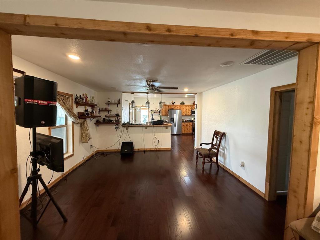 900 North Tiffin Road Ranger, TX 76470 - Photo 15 of 33 a view of a living room and a kitchen