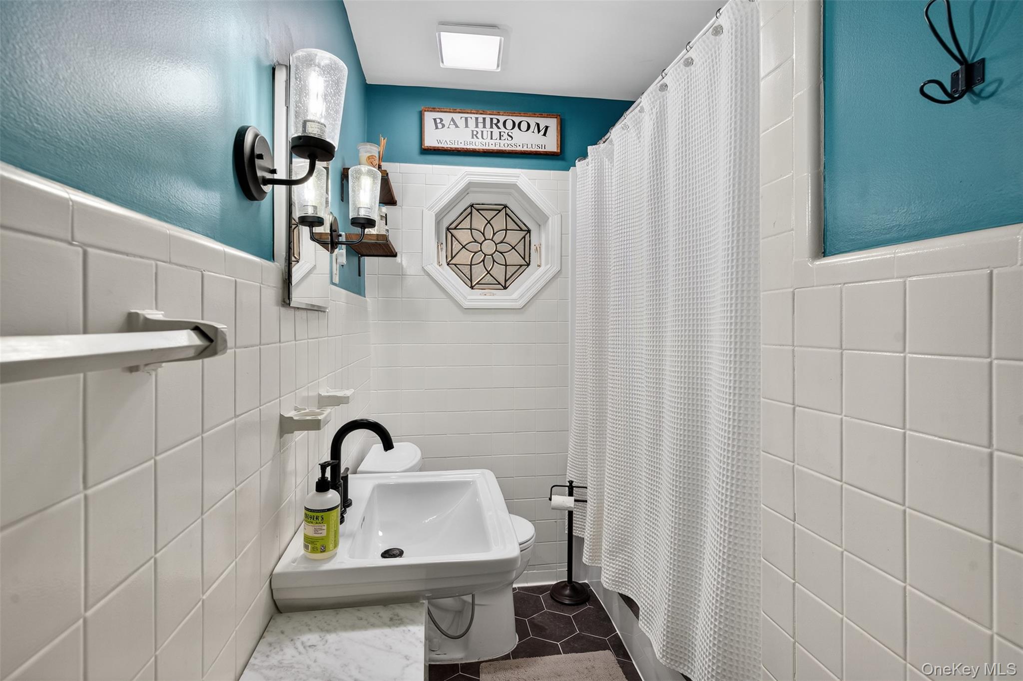 51 Ward Place Fishkill, NY 12524 - Photo 13 of 25 a bathroom with a toilet and a sink