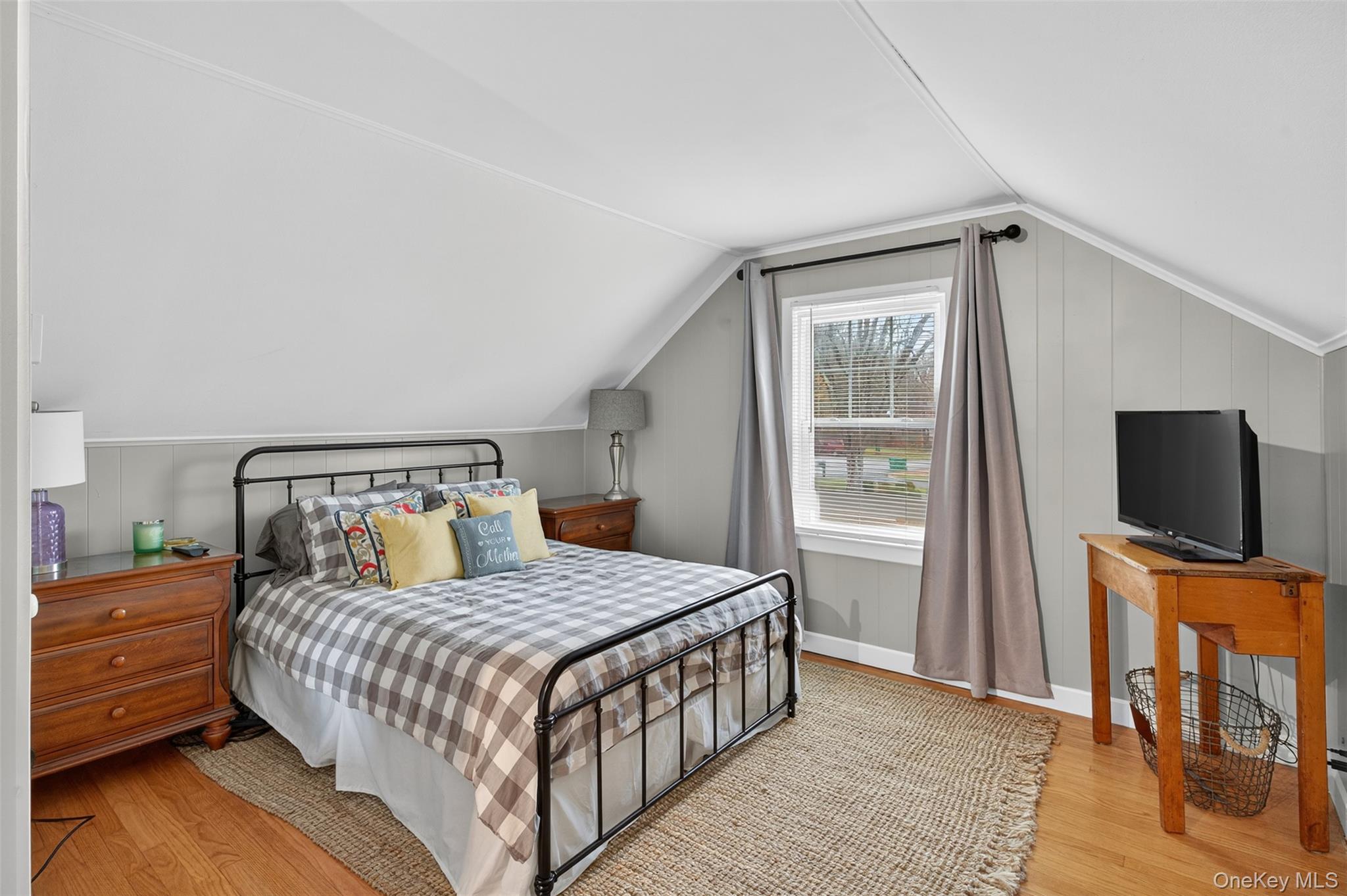 51 Ward Place Fishkill, NY 12524 - Photo 17 of 25 a bedroom with a bed and a flat tv screen on a dresser