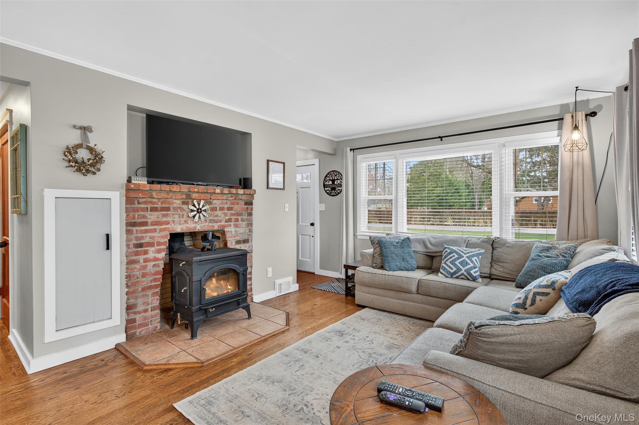 51 Ward Place Fishkill, NY 12524 - Photo 6 of 25 a living room with furniture a flat screen tv and a fireplace