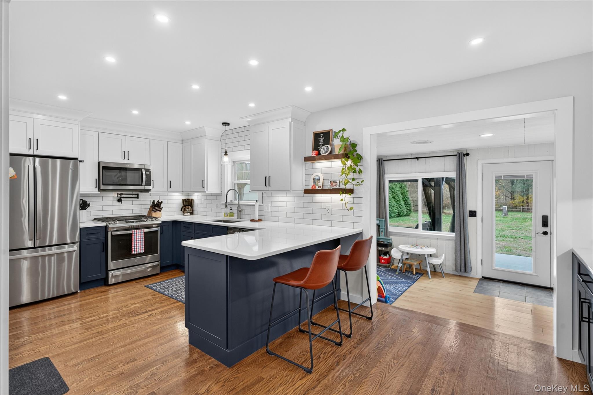 51 Ward Place Fishkill, NY 12524 - Photo 7 of 25 a kitchen with stainless steel appliances granite countertop a refrigerator and a stove top oven