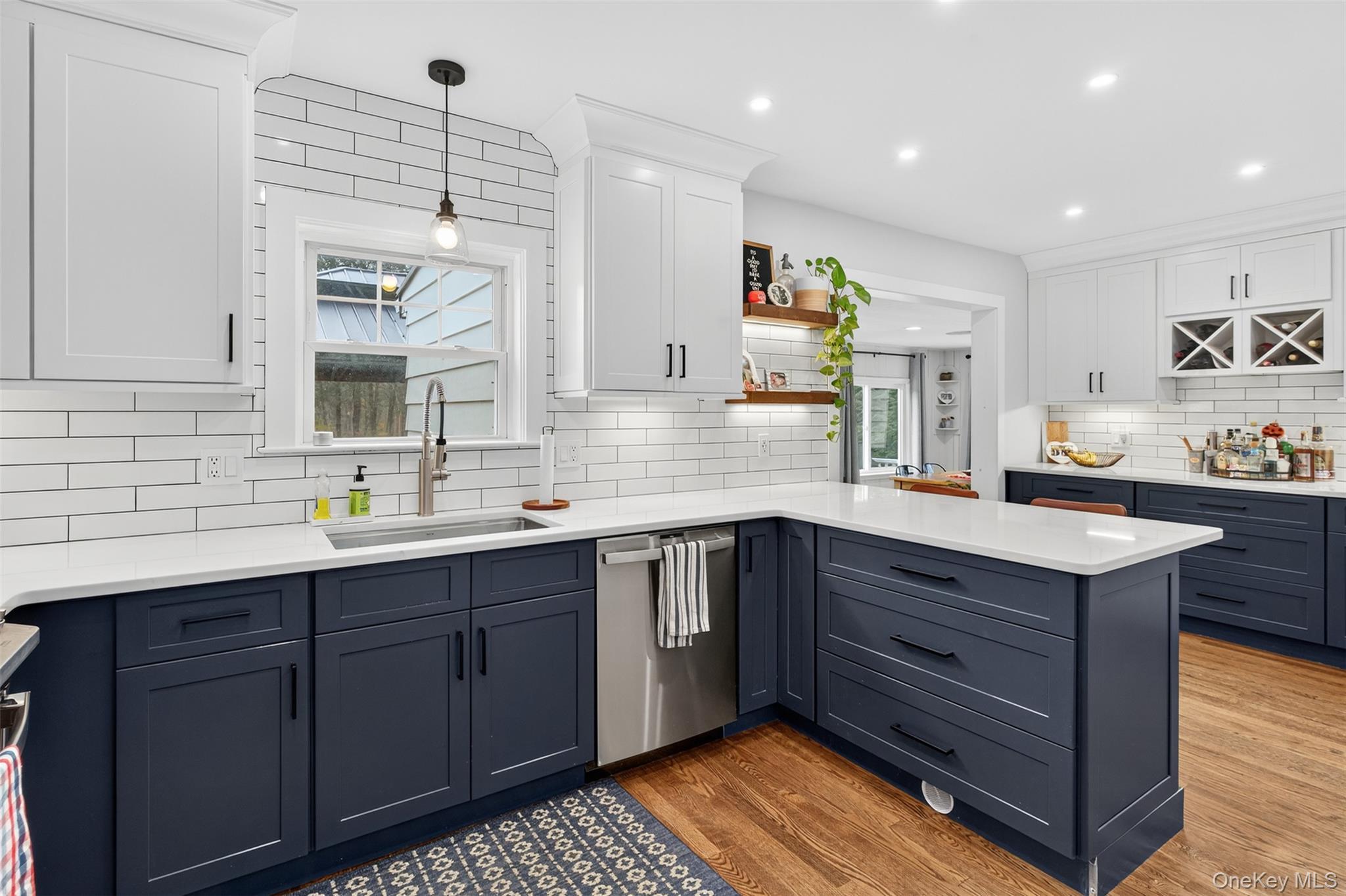 51 Ward Place Fishkill, NY 12524 - Photo 9 of 25 a kitchen with stainless steel appliances granite countertop a sink and wooden cabinets