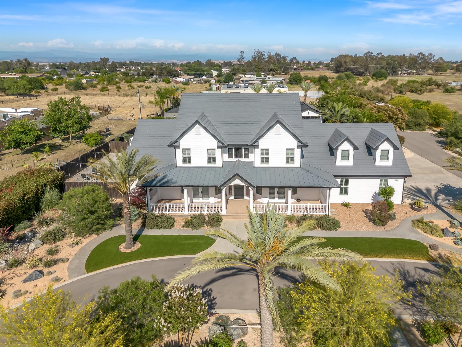 17113 Mark Road Madera, CA 93636 - Photo 88 of 99 an aerial view of residential houses with outdoor space and ocean view