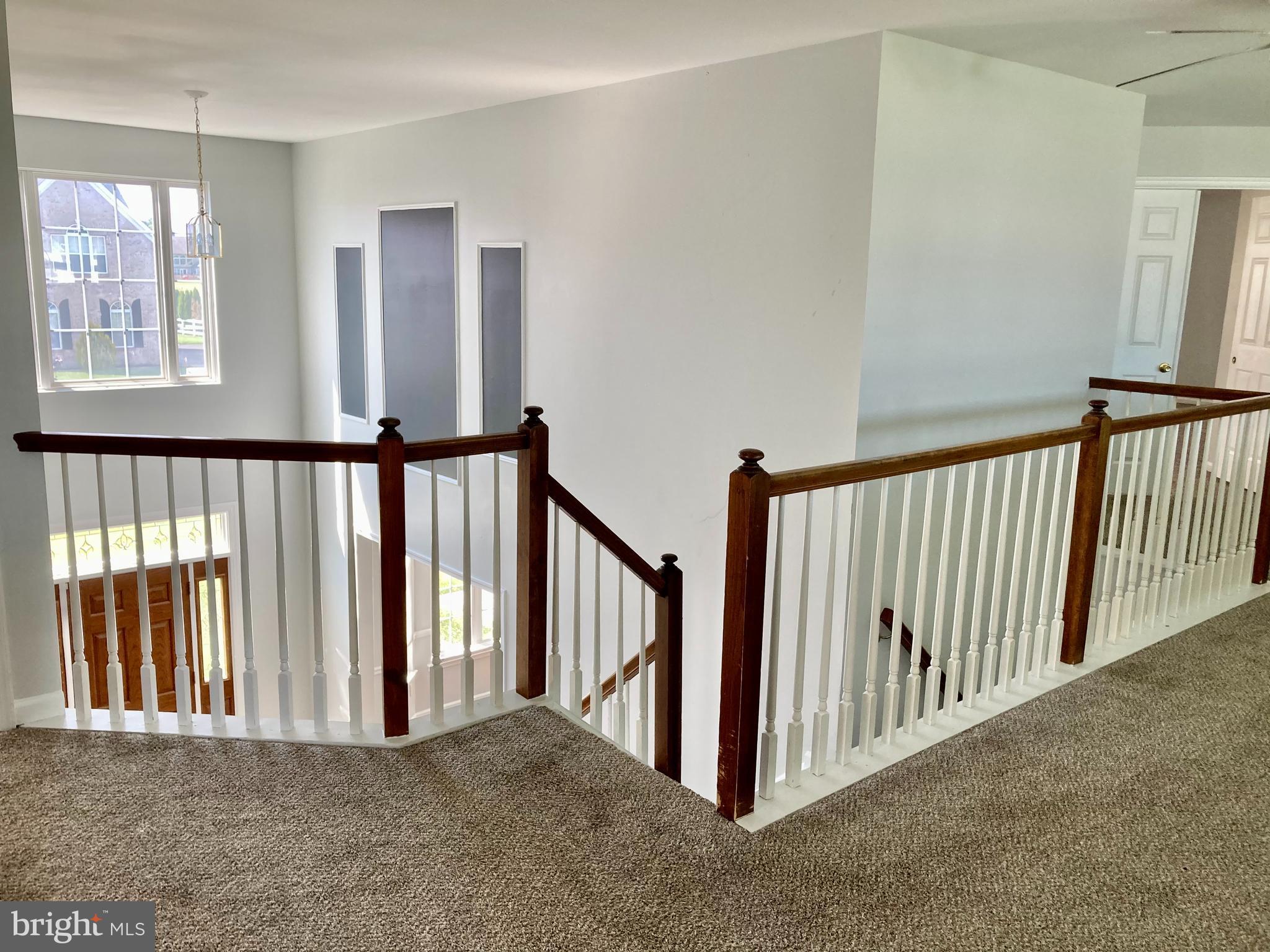 227 Mariners Way Bear, DE 19701 - Photo 11 of 19 a view of a hallway with windows