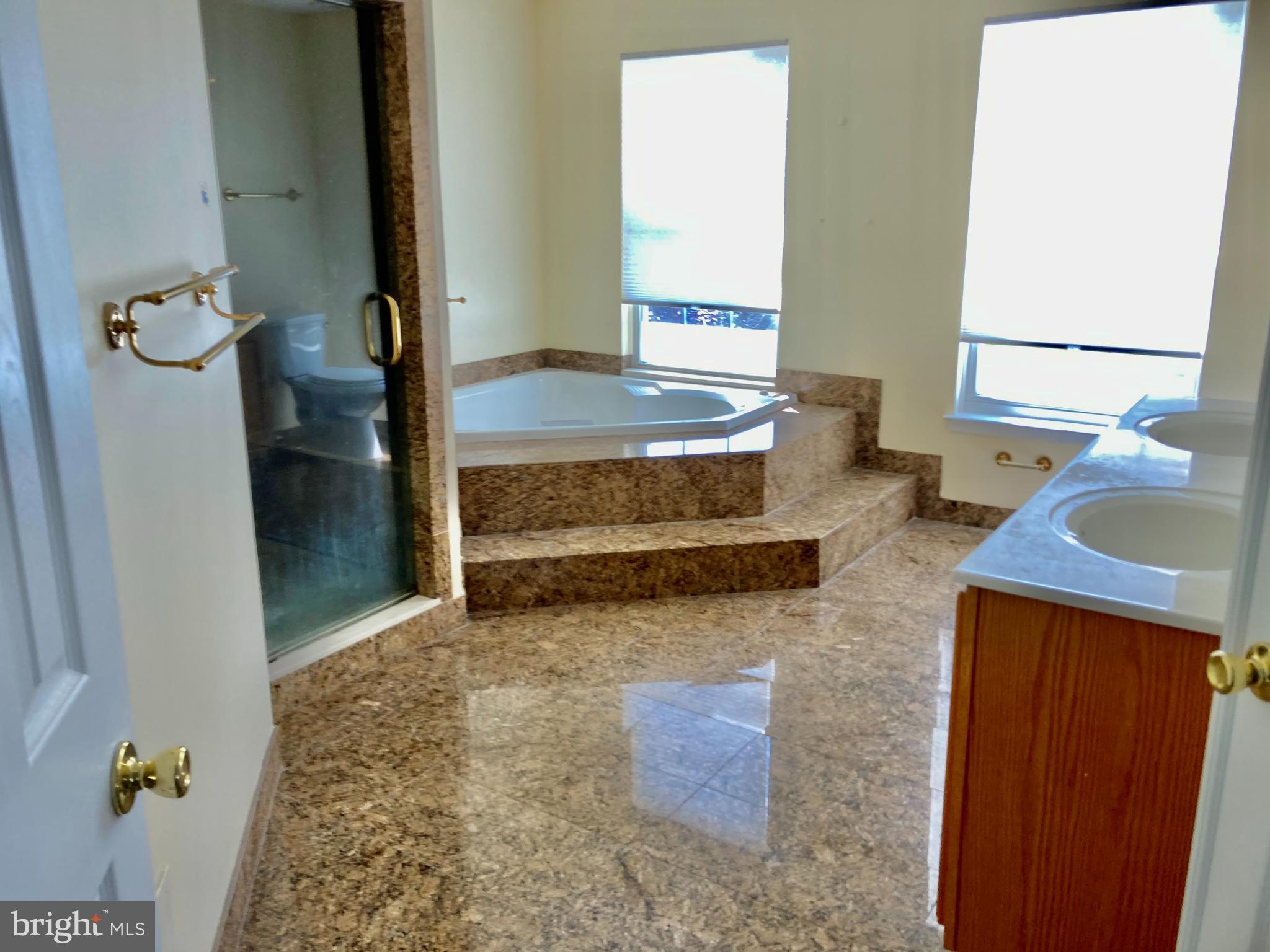 227 Mariners Way Bear, DE 19701 - Photo 14 of 19 a bathroom with a tub sink and mirror