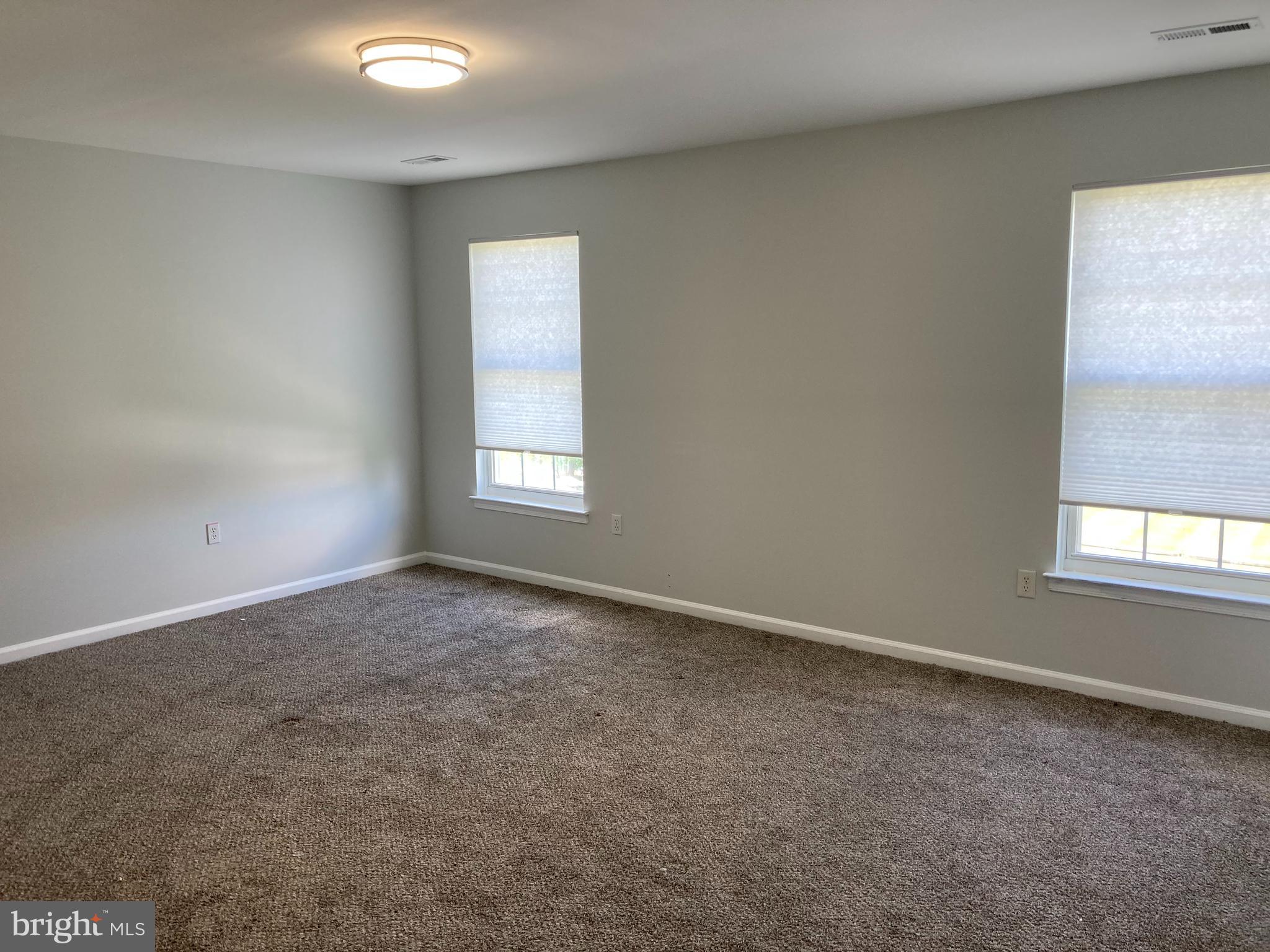 227 Mariners Way Bear, DE 19701 - Photo 17 of 19 an empty room with a window