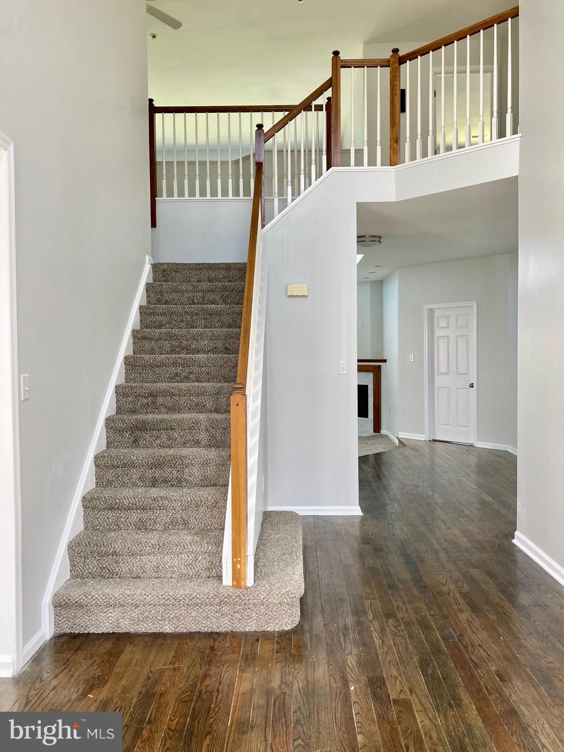 227 Mariners Way Bear, DE 19701 - Photo 3 of 19 a view of entryway and hall with wooden floor