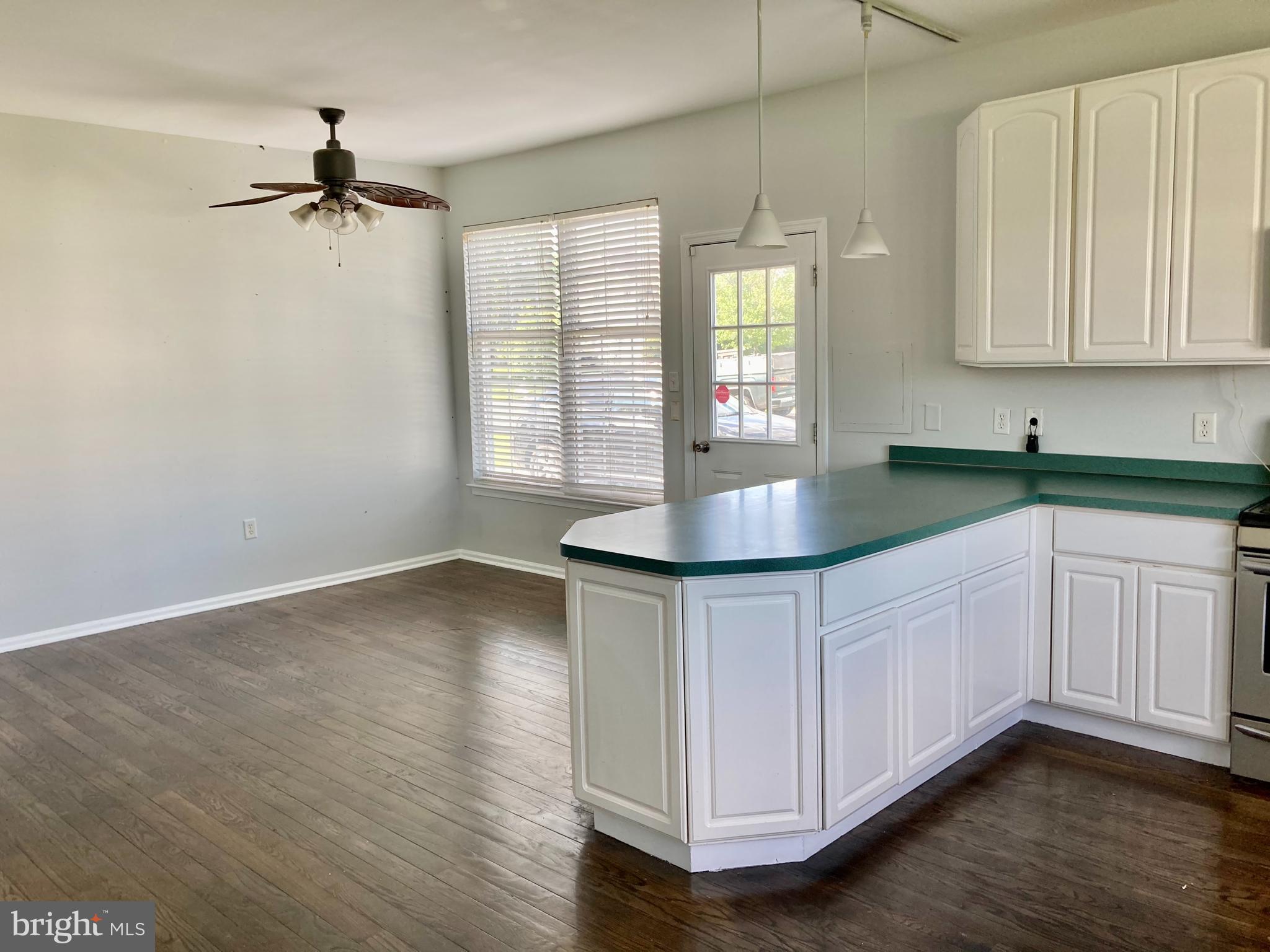 227 Mariners Way Bear, DE 19701 - Photo 7 of 19 a kitchen with stainless steel appliances granite countertop a sink a stove and a window