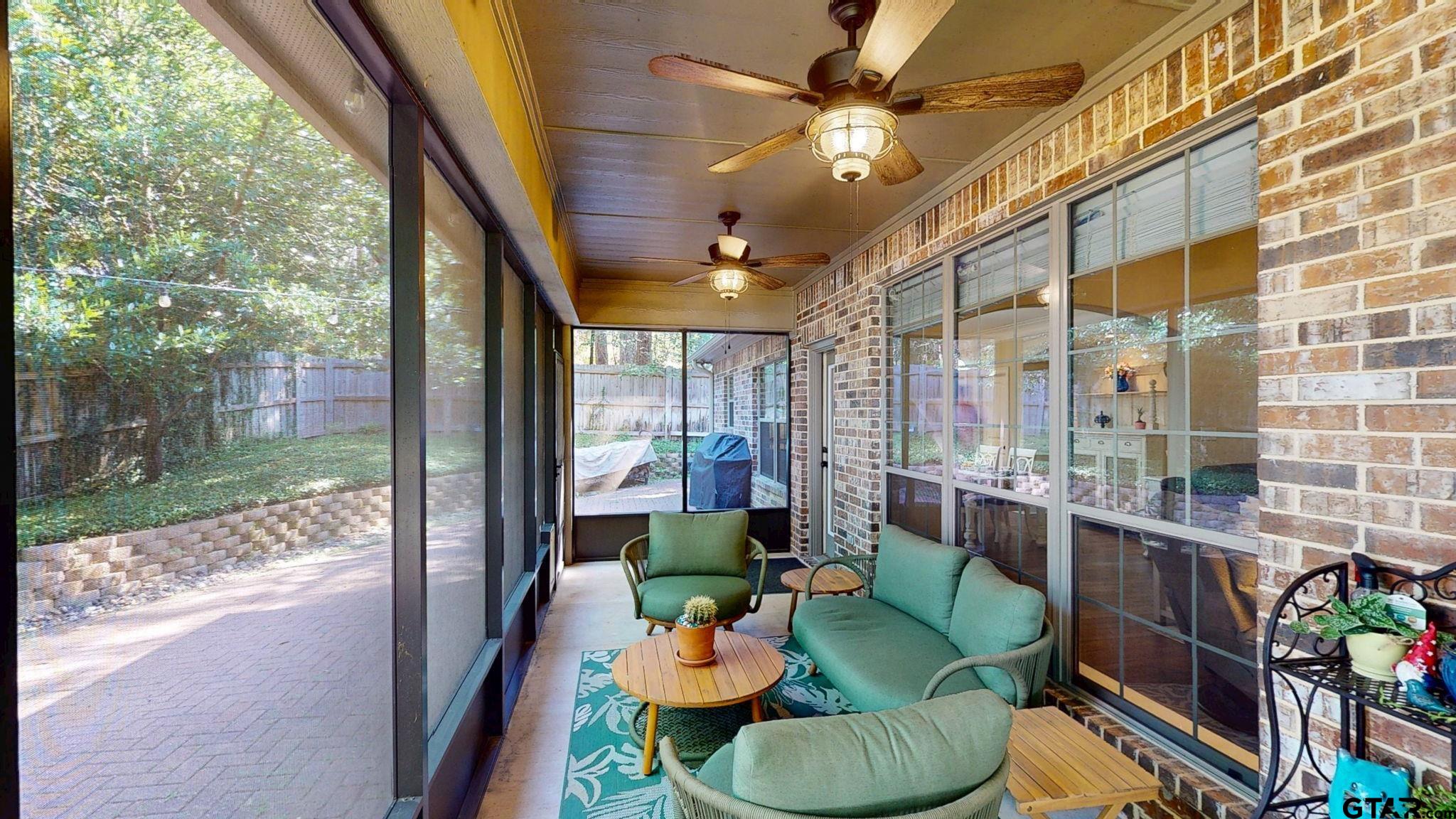 18488 Bluebird Circle Flint, TX 75762 - Photo 41 of 47 a living room with patio furniture and a floor to ceiling window