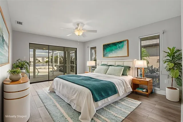 a spacious bedroom with a bed and a window