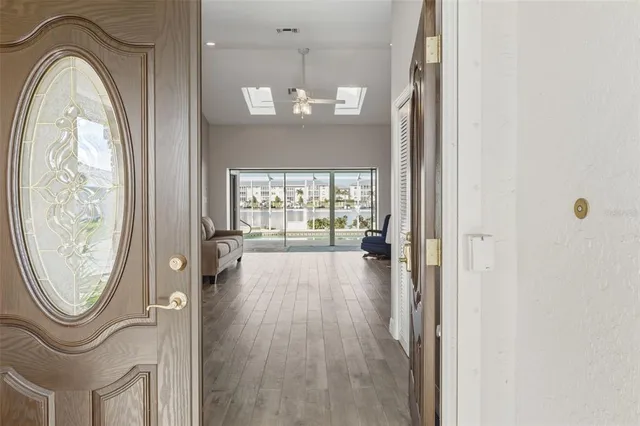 a view of a entryway door with wooden floor