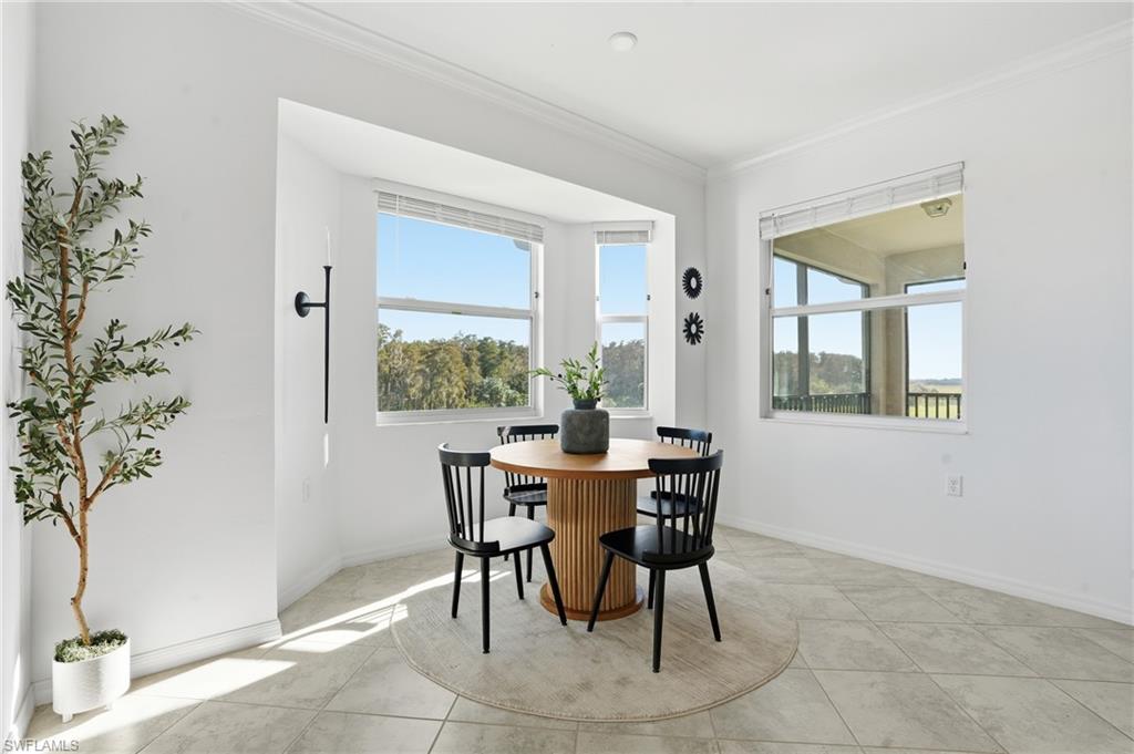 6046 National Boulevard, Unit 446 Immokalee, FL 34142 - Photo 11 of 50 a view of a dining room with furniture and window