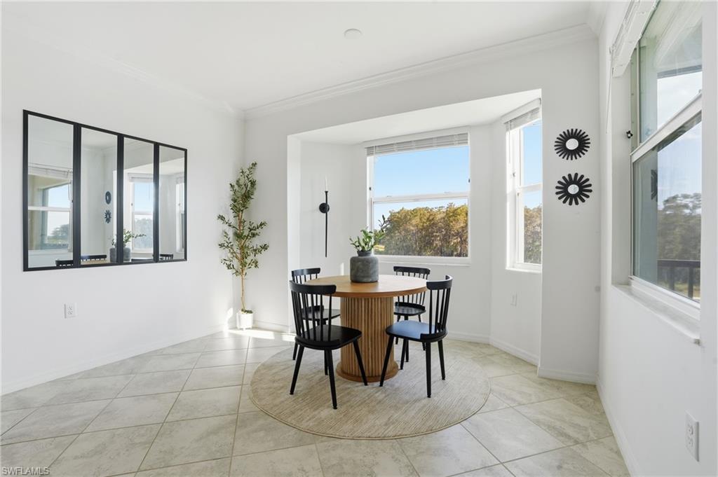6046 National Boulevard, Unit 446 Immokalee, FL 34142 - Photo 13 of 50 a dining room with furniture and window