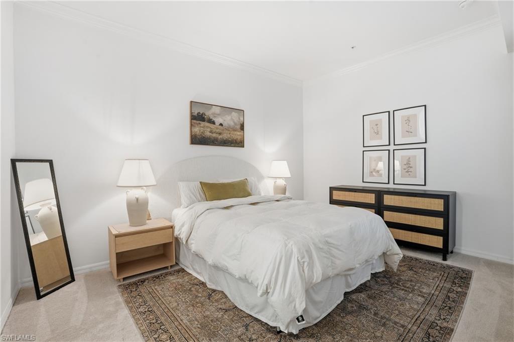 6046 National Boulevard, Unit 446 Immokalee, FL 34142 - Photo 14 of 50 a bedroom with a bed and a painting on the wall