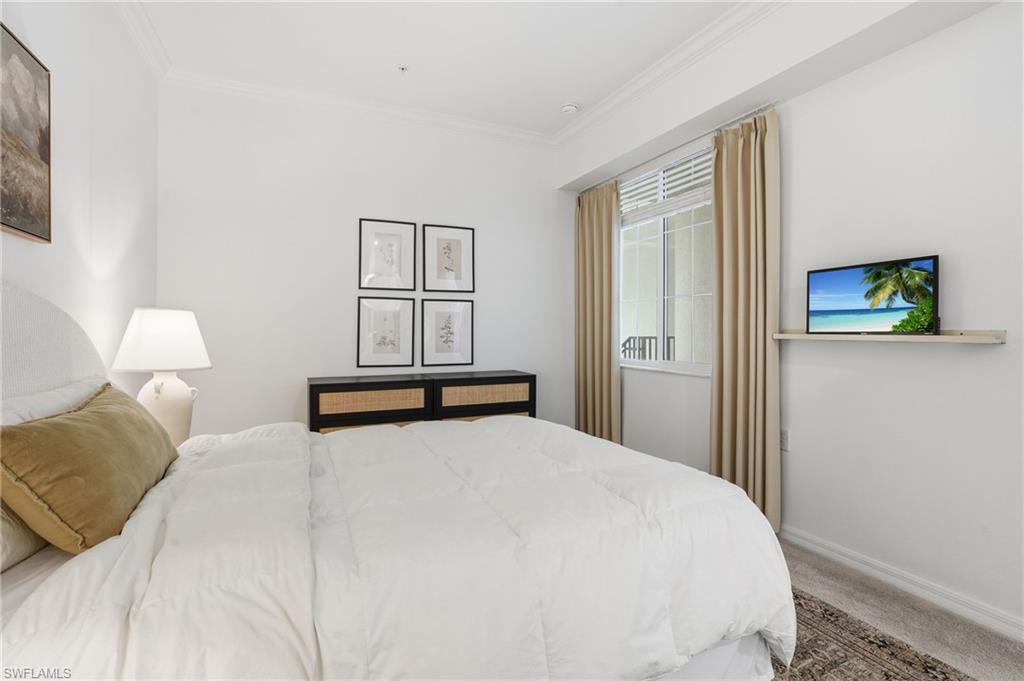 6046 National Boulevard, Unit 446 Immokalee, FL 34142 - Photo 15 of 50 a bedroom with a bed and window