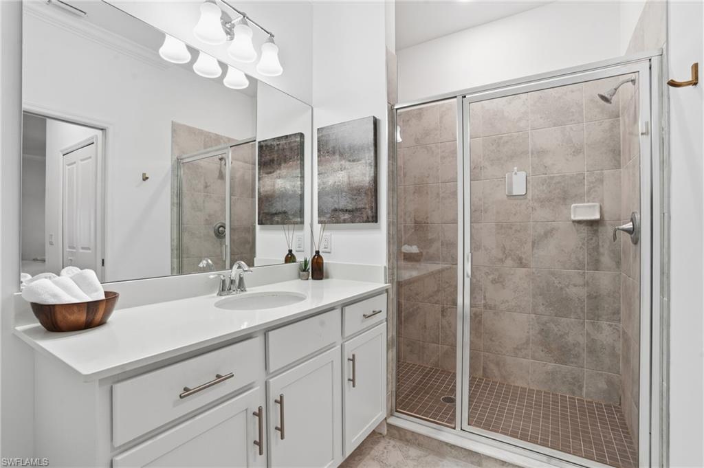 6046 National Boulevard, Unit 446 Immokalee, FL 34142 - Photo 17 of 50 a bathroom with a sink and a mirror