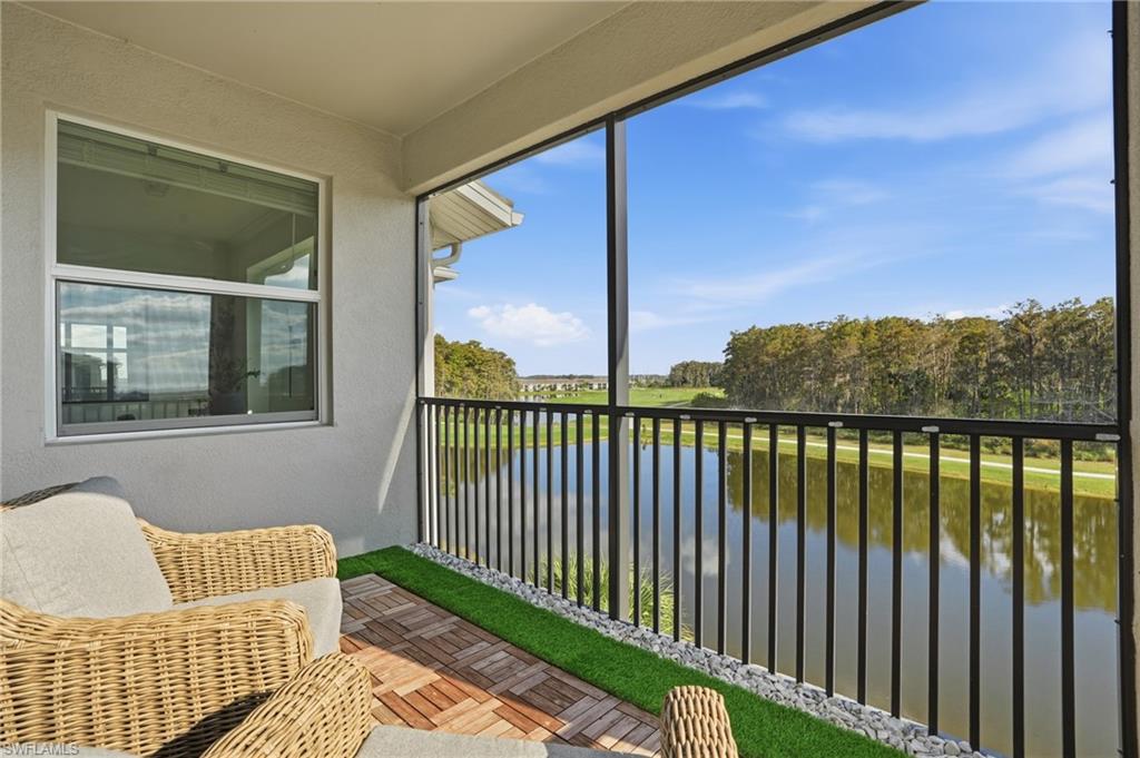 6046 National Boulevard, Unit 446 Immokalee, FL 34142 - Photo 21 of 50 a porch with a bench